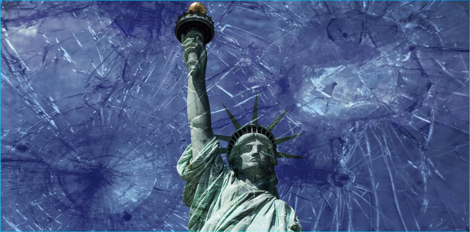 Photo looking up at the statue of liberty with a blue sky in the background and shattered glass in the foreground
