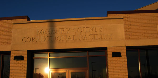 Photo of the top of the front entrance of McHenry County Correctional Facility; the facility's name is engraved in the concrete facade