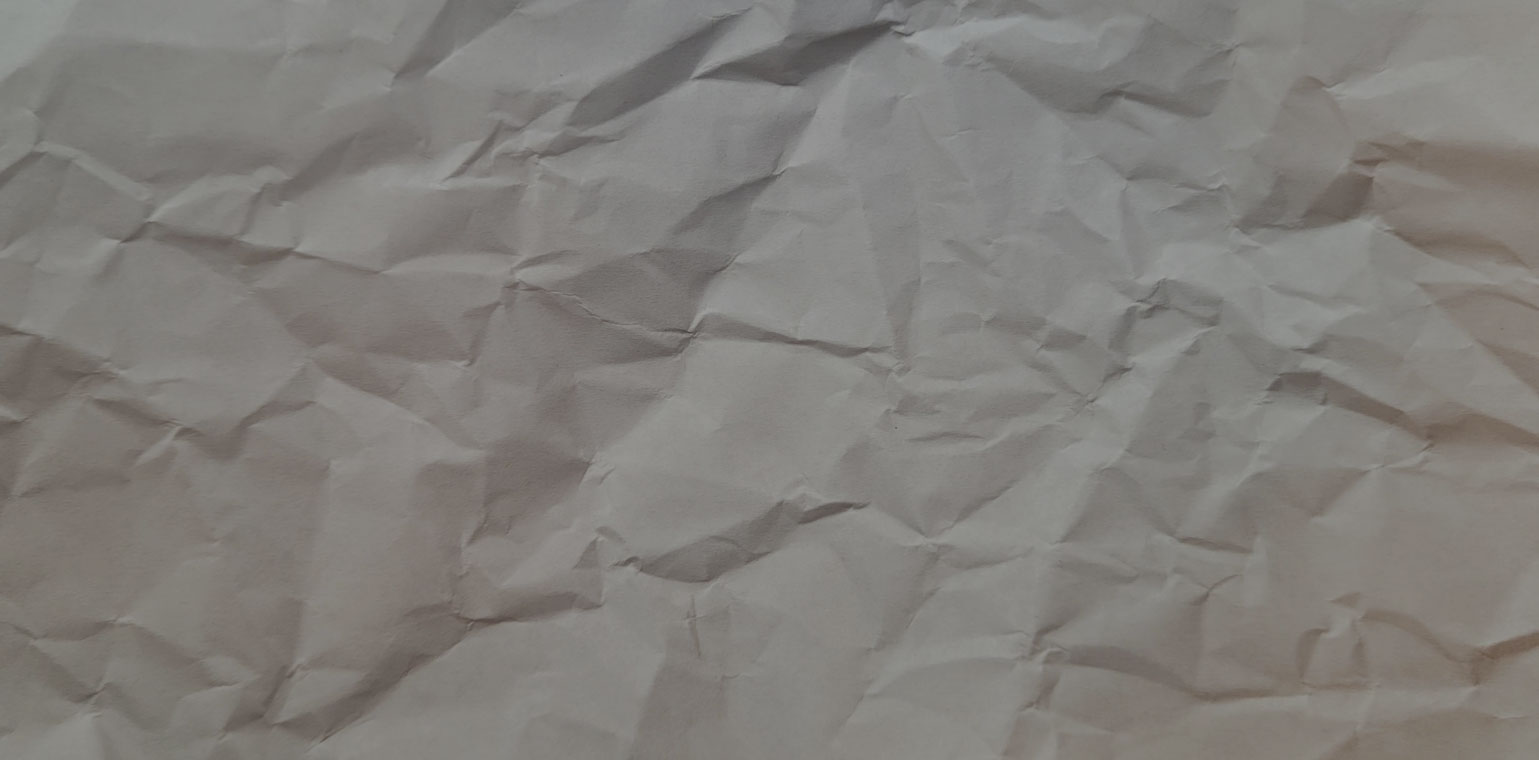 Background texture of a sheet of crumpled white paper