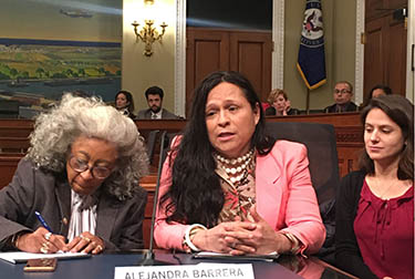 Woman testifying at a Congressional hearing