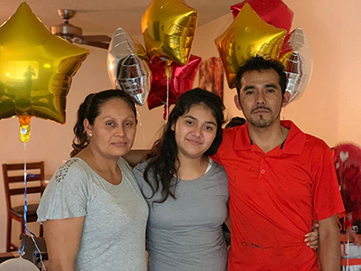 Photo of Margaret's reunion with her family after she was released from detention