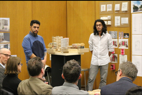 Manny presenting a building he designed. 