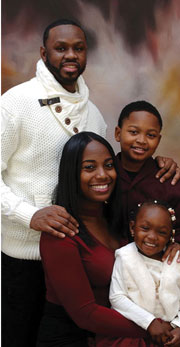 Family portrait of Issa, his wife, and their two children