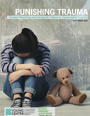 Image of the cover of the report "Punishing Trauma" - a young child sits on the ground with her knees curled up and face downward, and a teddy bear at her side.
