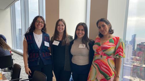A photo of four NIJC staff members at NIJC's July 2024 Mega Asylum Workshop