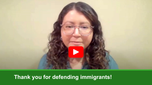 Preview of video with red play button. A woman with glasses and long curly hair is looking ahead and speaking. "Thank you for defending immigrant rights" is in a green banner at the bottom.