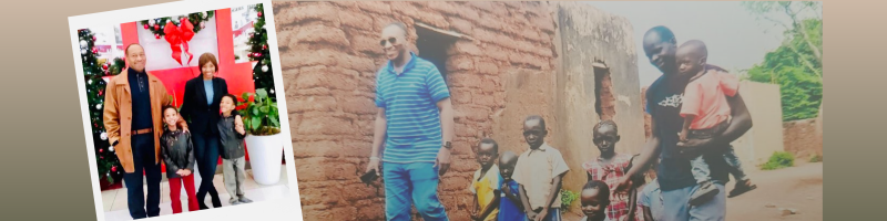 On the left is a snapshot of Ibrahima with his wife and two kids posing in front of a large Christmas wreath. In the background is a photo of Ibrahima in Mali walking with a group of young children and another man along a dirt road, next to a small building made of concrete and mud bricks.